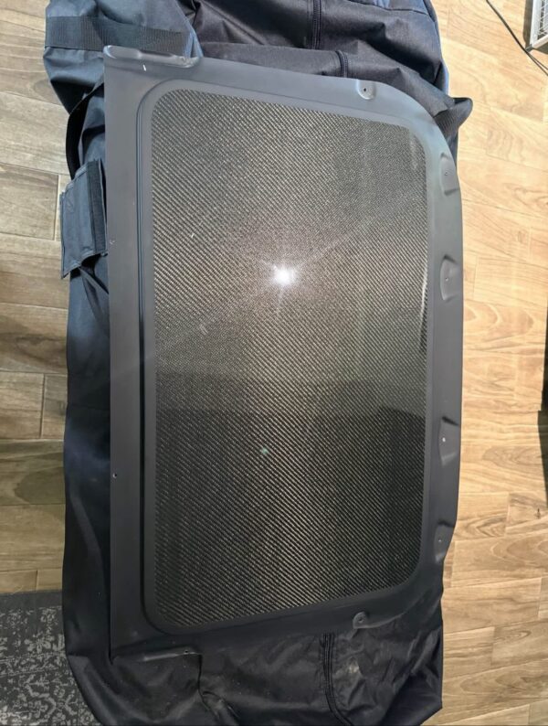 E46 carbon fiber sunroof delete panel.